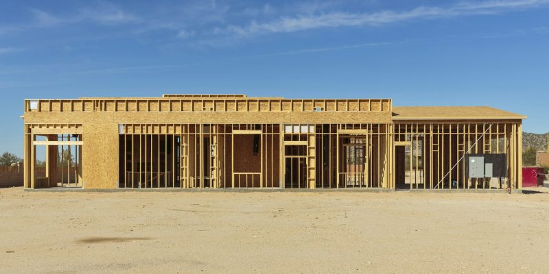 Construction of house under blue sky