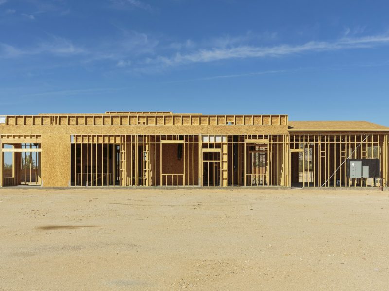 Construction of house under blue sky