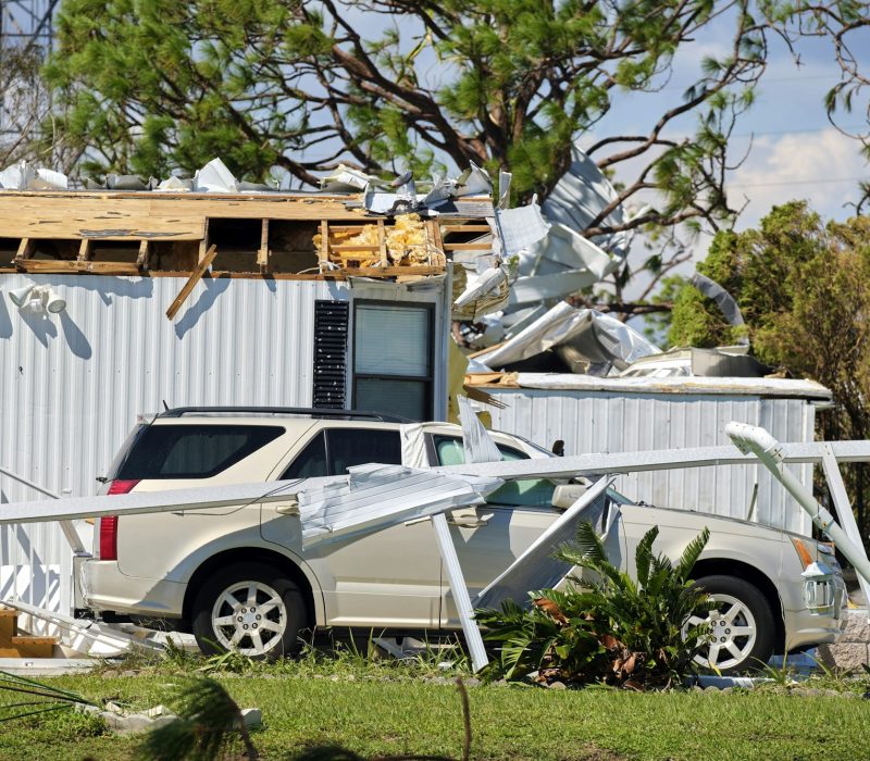 Severely damaged by hurricane Ian house and vehicle in Florida